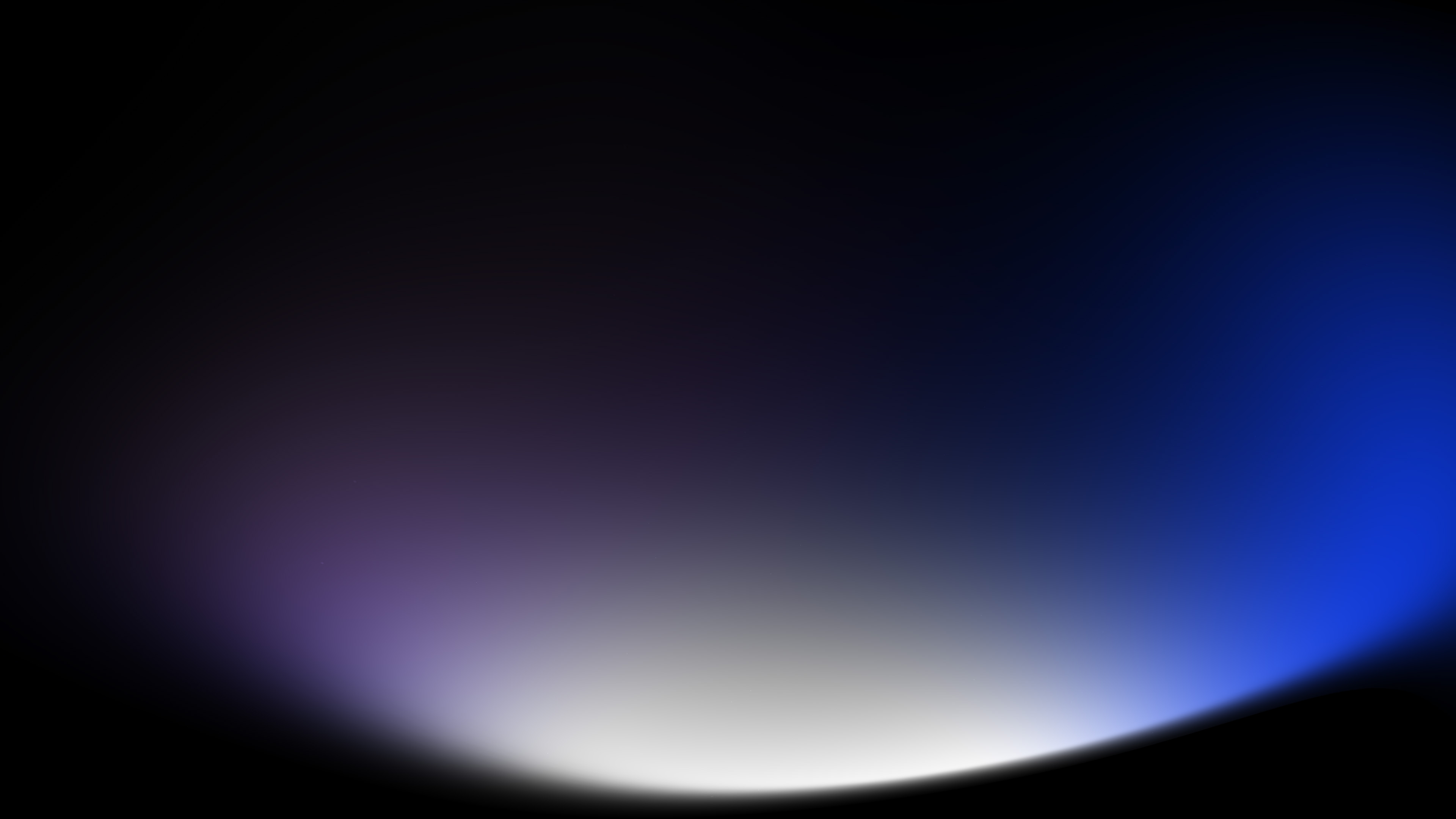 Abstract blue and violet light glowing across a dark background
